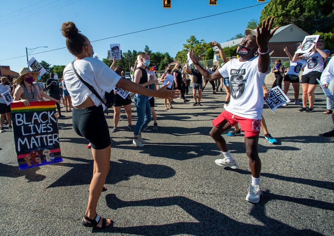 (Rick Egan  |  The Salt Lake Tribune)     Bella Swan and Manson Kafi dance to the Jackson 5, with protesters on Foothill Drive during a march for Justice on Sunday, July 12, 2020.