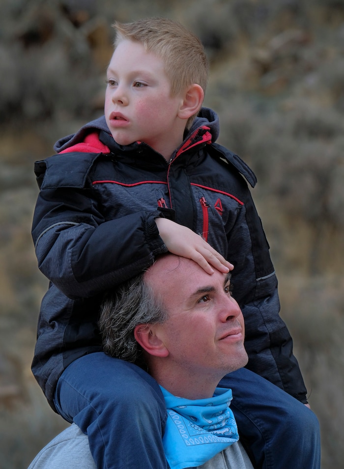 (Leah Hogsten | The Salt Lake Tribune) Wolf Balmanno from Cedar City carries his son Alex, 7, on his shouders during the spring equinox observance, Saturday, Mar. 20, 2021 while on an interpretive tour with a program guide from the Parowan Heritage Foundation.