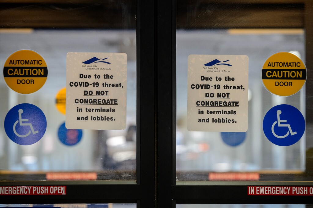 (Trent Nelson | Tribune file photo) A sign at Salt Lake City International Airport reads, "Due to the COVID-19 threat, Do Not Congregate," on Wednesday, April 1, 2020.
