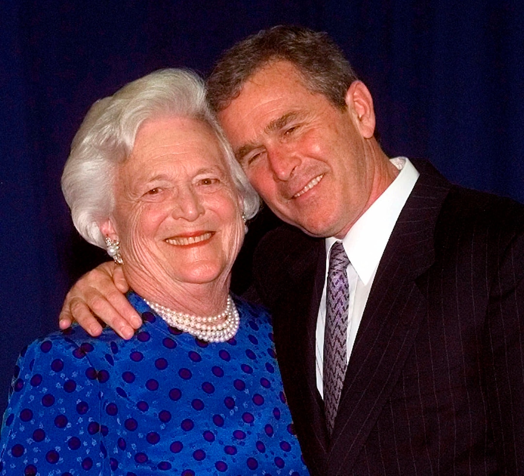 FILE - In this June 10, 1999, file photo, Texas Gov. George W. Bush, right, gives his mother, Barbara Bush, a hug after taking a family photo in Houston. A family spokesman said Tuesday, April 17, 2018, that former first lady Barbara Bush has died at the age of 92. (AP Photo/David J. Phillip, File)
