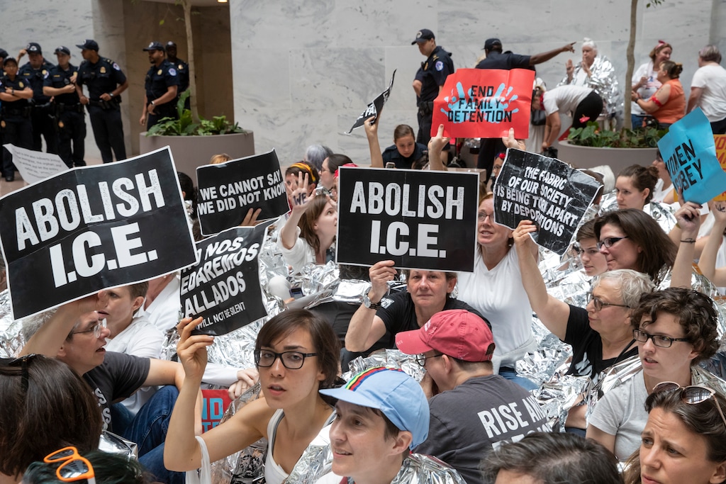 Hundreds of activists protest the Trump administration's approach to illegal border crossings and separation of children from immigrant parents, in the Hart Senate Office Building on Capitol Hill in Washington, Thursday, June 28, 2018. Several prominent Democrats who are mulling a bid for the White House in 2020 sought to bolster their progressive credentials this week by calling for major changes to immigration enforcement, with some pressing for the outright abolition of the federal government’s chief immigration enforcement agency.  (AP Photo/J. Scott Applewhite)