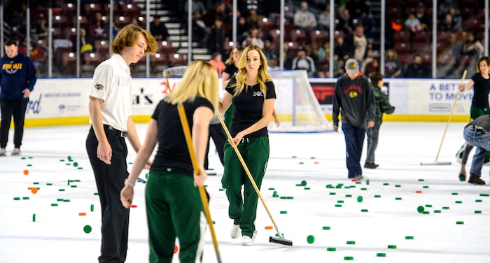 (Steve Griffin  |  The Salt Lake Tribune) Utah Grizzlies employees clean up after the fan "puck toss" between the second and third period of the hockey game against the Idaho Steelheads at the Maverik Center in West Valley City Monday Feb. 19, 2018.