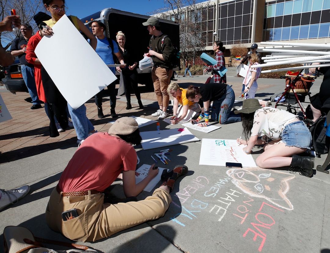 (George Frey  |  special to The Salt Lake Tribune) BYU students and others gather in front of the Ernest L. Wilkinson Student Center on the campus of Brigham Young University to protest BYUÕs rollback of a newly announced policy change on LGBTQ students on March 5, 2020 in Provo, Utah.