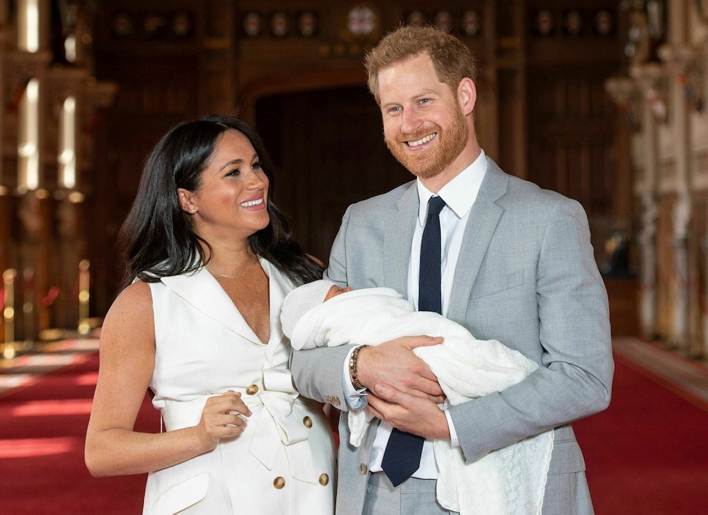 (Dominic Lipinski | Pool via AP)  Britain's Prince Harry and Meghan, Duchess of Sussex, pose during a photocall with their newborn son, in St George's Hall at Windsor Castle, Windsor, south England, Wednesday, May 8, 2019.