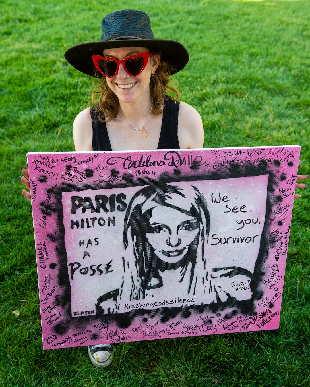 (Rick Egan  |  The Salt Lake Tribune)    Artist Jennifer Korsen created a work of art signed by survivors, to give for Paris Hilton, during a rally calling for the closure of Provo Canyon School, a residential treatment center in Utah she attended when she was a teen, on Friday, Oct. 9, 2020.