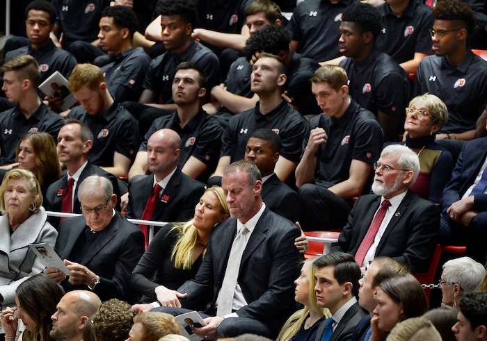 Scott Sommerdorf | The Salt Lake Tribune
With the University of Utah basketball team behind him, Utah head coach Larry Krystkowiak is comforted by his wife Jan as he reacts with some emotion during the funeral services for Jon M. Huntsman, Sr., Saturday, February, 10, 2018. At right is former University president David W. Pershing.
