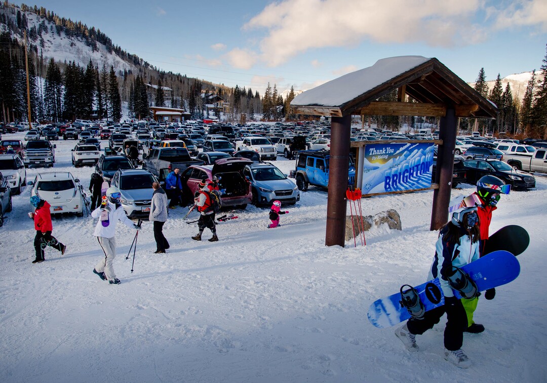 (Francisco Kjolseth  | The Salt Lake Tribune) People take to the slopes at Brighton Resort in Big Cottonwood Canyon on Tuesday, Jan. 5, 2020. Skiers were down during the holidays overall due to the low snow levels and the pandemic. Most out of staters kept their reservations, but some locals stayed away, waiting for better conditions.