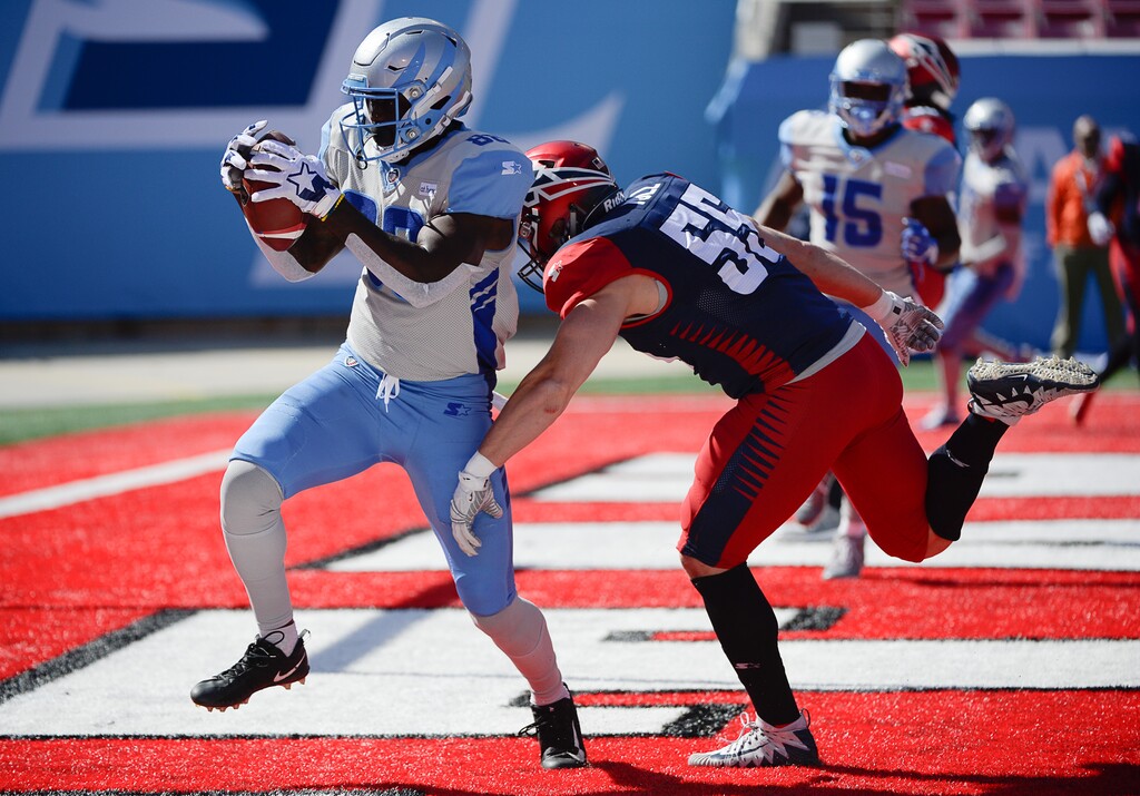(Francisco Kjolseth  |  The Salt Lake Tribune)  Anthony Denham #88 of the Salt Lake Stallions scores a touchdown ahead of Davis Tull #55 of the Memphis Express as the Stallions host the Memphis Express of the Alliance of American Football in Salt Lake City on Saturday March 16, 2019.