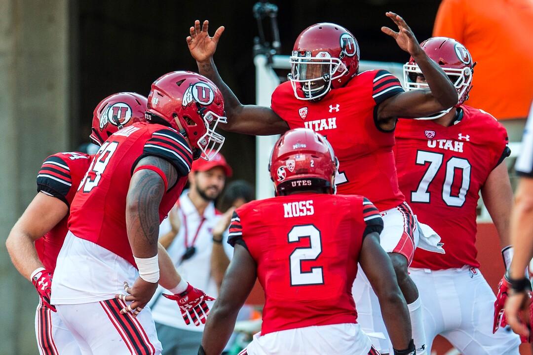 (Chris Detrick  |  The Salt Lake Tribune)  Utah Utes quarterback Tyler Huntley (1) celebrates his touchdown with his teammates during the game at Rice-Eccles Stadium Thursday, August 31, 2017. Utah Utes are leading North Dakota Fighting Hawks 17-9 at halftime. 