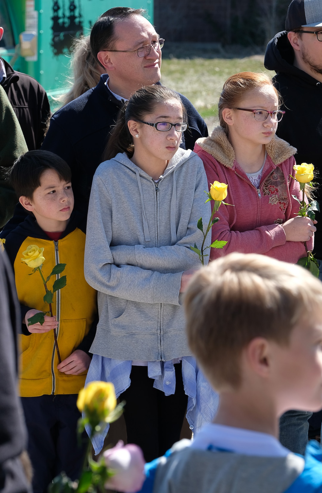 (Francisco Kjolseth  |  The Salt Lake Tribune)  David Smith of Spanish Fork is joined by his children Stockton, 9, Kadence, 13, and Tayah, 11, from left, as they gather outside of the Al Sahaba Mosque in Orem waiting for members to conclude Friday prayers to show them love and support following the tragic shootings in New Zealand. 
