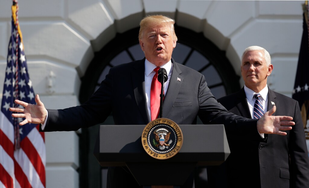 (Evan Vucci | The Associated Press) President Donald Trump delivers remarks on the economy at the White House, Friday, July 27, 2018, in Washington. Vice President Mike Pence is at right.