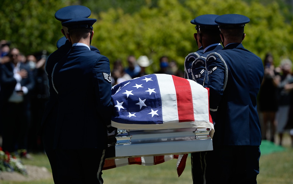 (Francisco Kjolseth  |  The Salt Lake Tribune ) Members of the Hill Air Force Base honor guard carry the casket with Dallas Lynn Stevens, who served 38 years in the Utah Air National Guard, as he was laid to rest at the Utah Veterans Cemetery & Memorial Park in Bluffdale on Wednesday, June 24, 2020. Stevens is one of 13 residents of the William E. Christoffersen Veterans Home who died from COVID-19. He was buried with military honors.