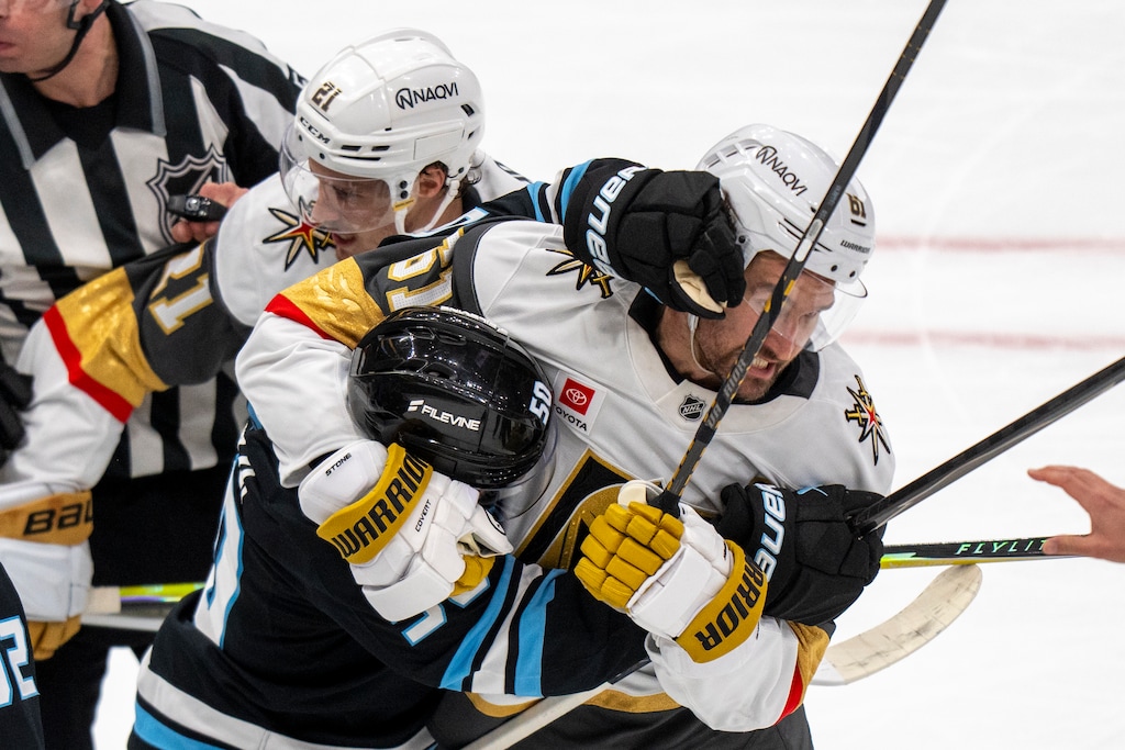 (Rick Egan | The Salt Lake Tribune) Utah Mammoth defenseman Sean Durzi (50) gets tangled up with Vegas Golden Knights right wing Mark Stone (61) during Game 6 of the series.