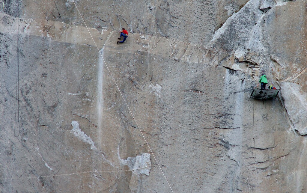 Tom Evans  |  CourtesyTommy Caldwell (in red) Climbing on Pitch 14 – Kevin belaying in green. 