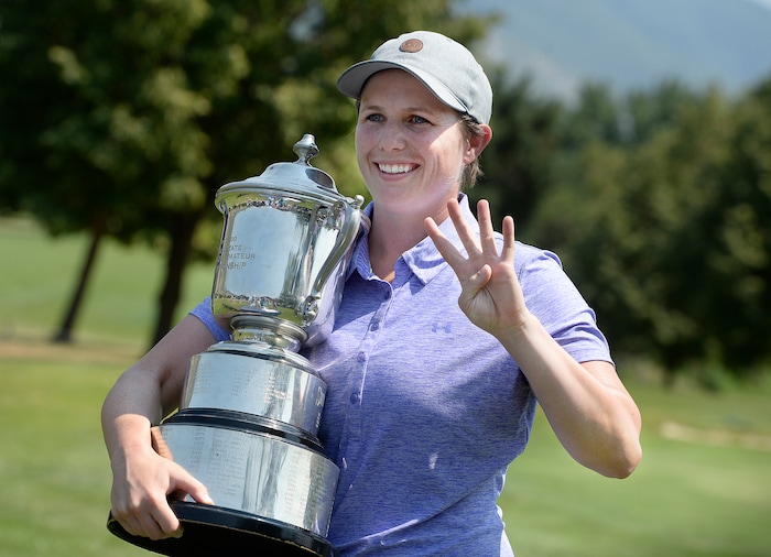 (Scott Sommerdorf   |  The Salt Lake Tribune)   Kelsey Chugg (Weber St.) holds up four fingers to signify the four times she has won the Utah Womens State Amateur Championship. Chugg defeated Anna Kennedy (BYU) to win the 111th Utah Womens State Amateur Championship held at Davis Park Golf Course in Fruit Heights, Friday, August 4, 2017.
