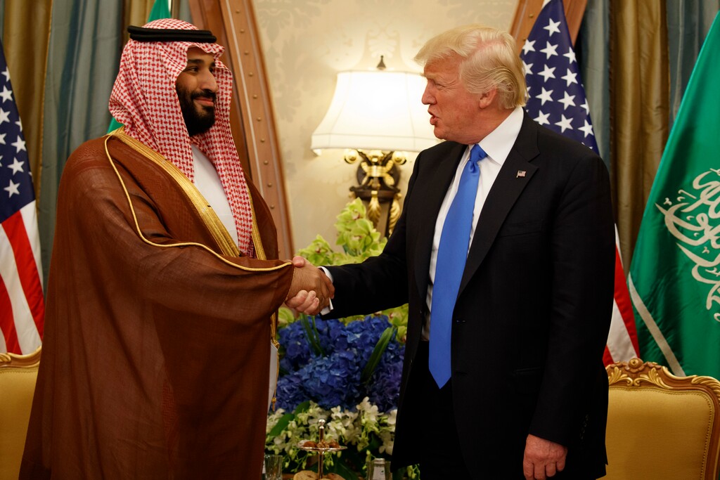 FILE - In this May 20, 2017, file photo, President Donald Trump shakes hands with Saudi Deputy Crown Prince and Defense Minister Mohammed bin Salman in Riyadh. In emails obtained by The Associated Press, George Nader claims he later met with Mohammed bin Salman, who by then had been elevated to crown prince, and Abu Dhabi’s crown prince, Sheikh Mohammed bin Zayed Al Nahyan, in a lobbying effort to alter U.S. policy in the Middle East. (AP Photo/Evan Vucci, File)