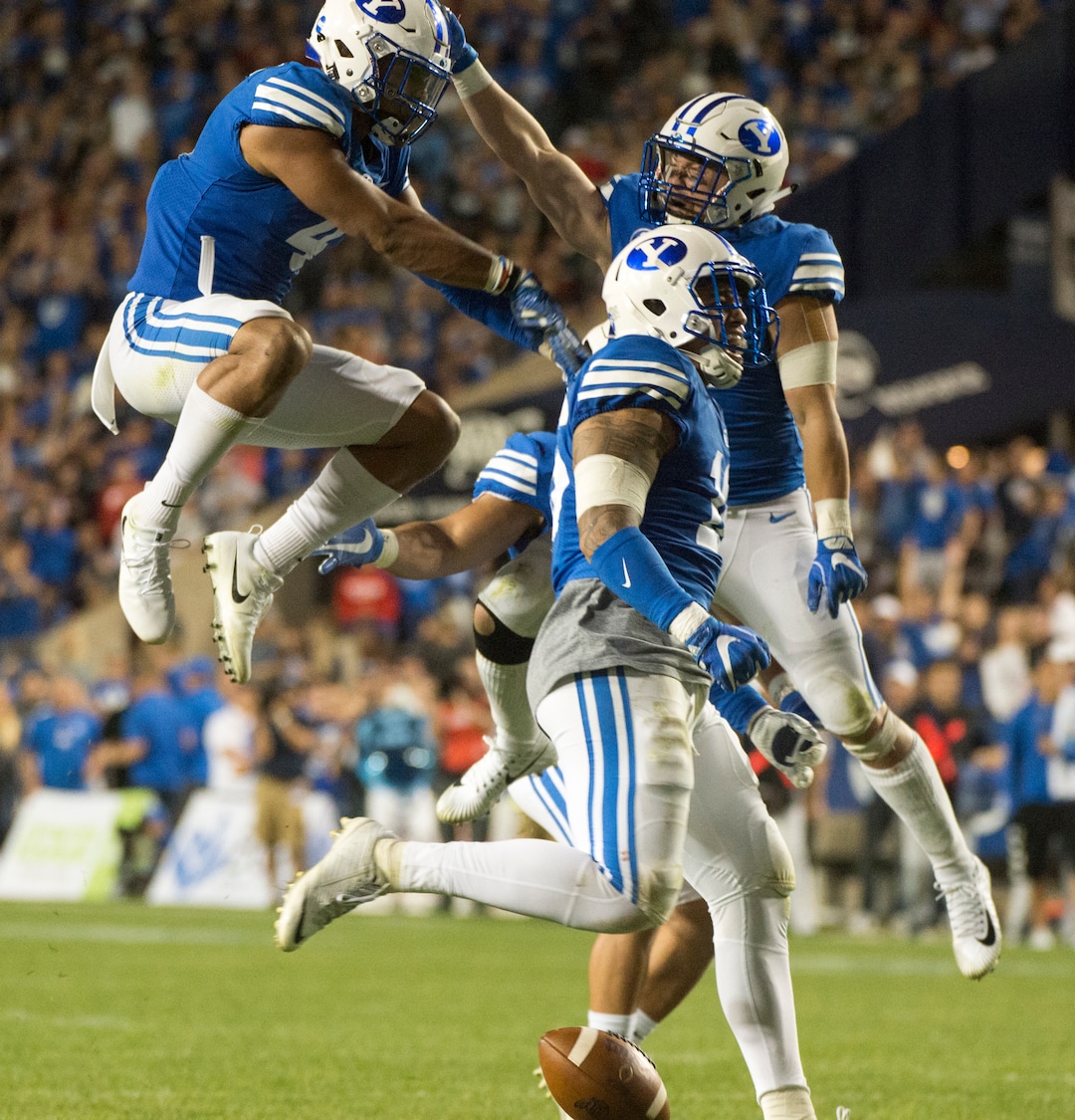 (Rick Egan  |  The Salt Lake Tribune) The Brigham Young Cougars celebrate after  linebacker Fred Warner (4) recoverd a fumble by Utah quarterback Tyler Huntley (1), in football action BYU vs Utah, at Lavell Edwards Stadium in Provo, Saturday, September 9, 2017.