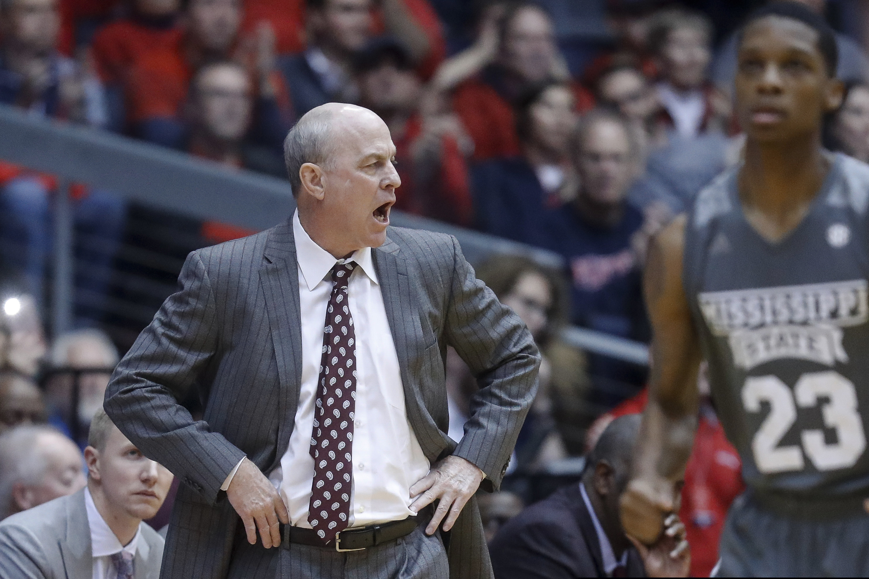 Mississippi State coach Ben Howland shouts during the first half of the team's NCAA college basketball game against Dayton, Friday, Nov. 30, 2018, in Cincinnati. (AP Photo/John Minchillo)