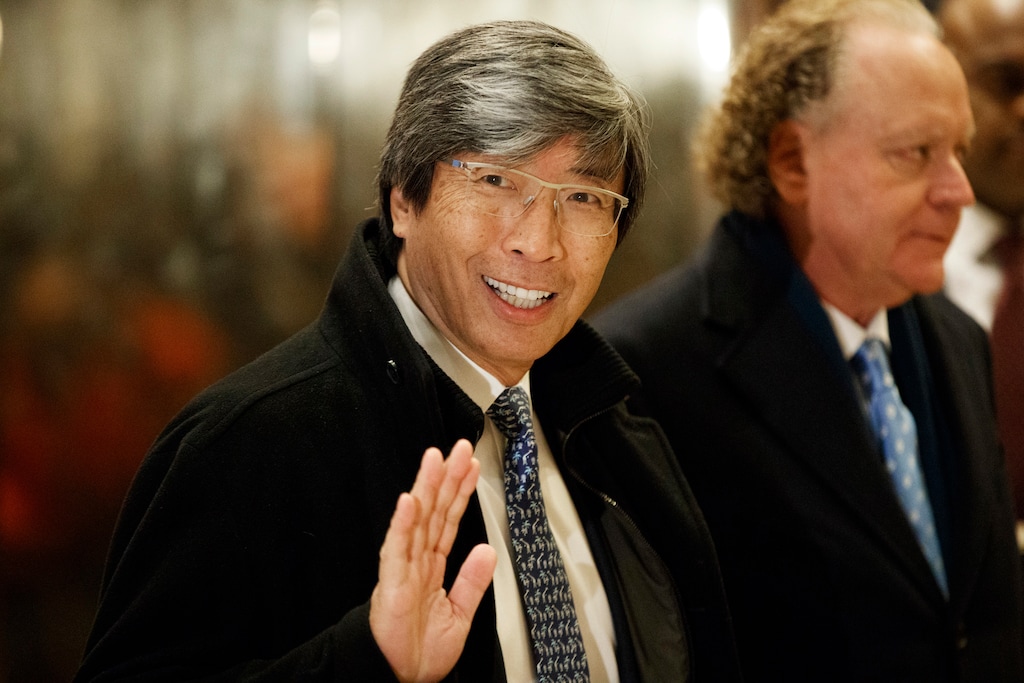 FILE - In this Jan. 10, 2017, file photo, pharmaceuticals billionaire Dr. Patrick Soon-Shiong waves as he arrives in the lobby of Trump Tower in New York for a meeting with President-elect Donald Trump. It was announced Wednesday, Feb. 7, 2018, that the Los Angeles Times is being sold to Soon-Shiong, a local billionaire, for $500 million, ending its strained tenure under the owner of the Chicago Tribune. (AP Photo/Evan Vucci, File)