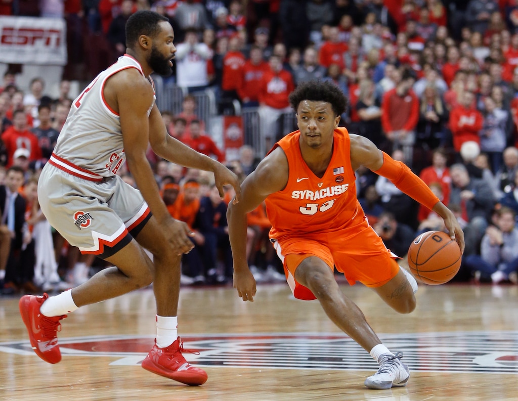 Syracuse's Elijah Hughes, right, drives to the basket against Ohio State's Keyshawn Woods during the first half of an NCAA college basketball game Wednesday, Nov. 28, 2018, in Columbus, Ohio. (AP Photo/Jay LaPrete)