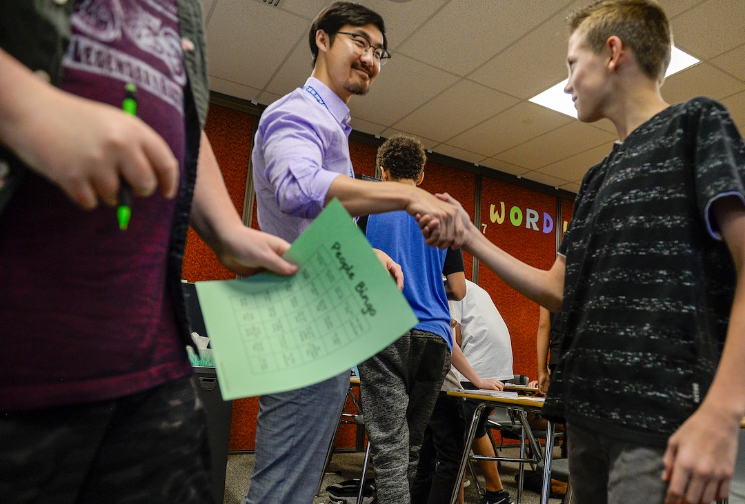 (Leah Hogsten  |  The Salt Lake Tribune) Oquirrh Hills Middle School eighth grade math instuctor Pinyi Yao and his students get to know each other playing People Bingo on the first day of school. Pinyi Yao, 27, a Chinese National teaching 7th and 8th grade math welcomes his students on their first day of the school year at Oquirrh Hills Middle School, August 20, 2019 in Riverton.