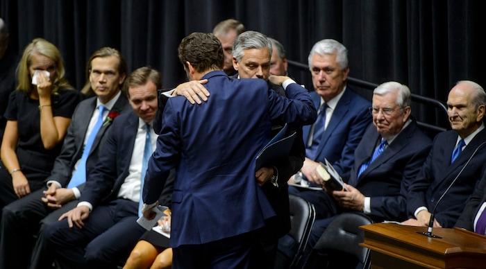 (Steve Griffin  |  The Salt Lake Tribune)  Peter Huntsman hugs his brother Jon Huntsman Jr. after he spoke during funeral services for Jon Huntsman Sr. at the Huntsman Center on the University of Utah campus in Salt Lake City Saturday February 10, 2018.