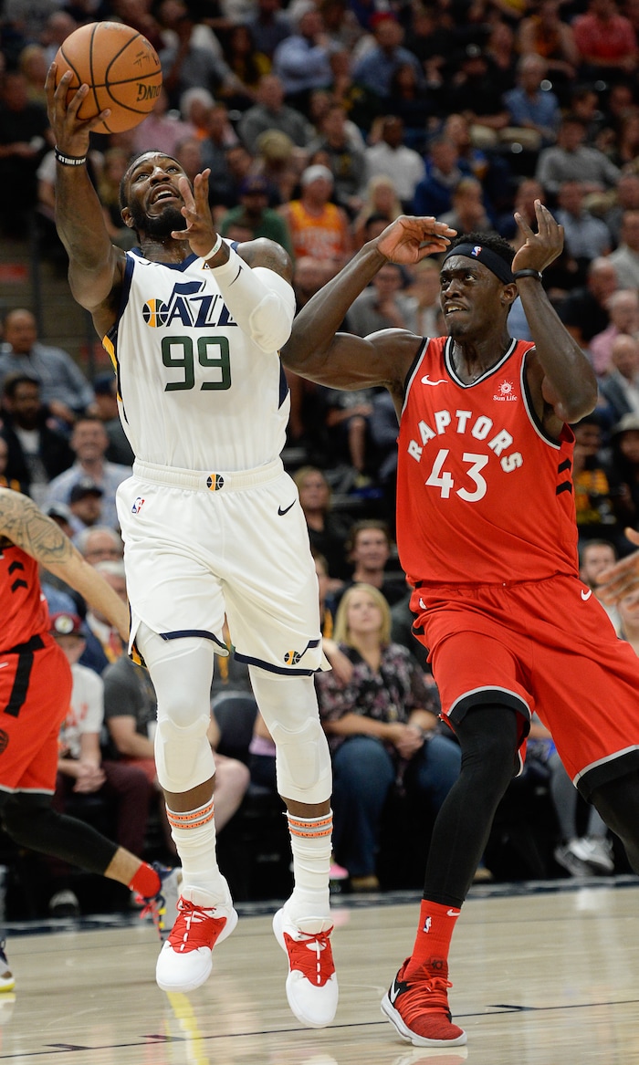(Francisco Kjolseth  |  The Salt Lake Tribune)  Utah Jazz forward Jae Crowder (99) works the ball past Toronto Raptors forward Pascal Siakam (43) in the first half of the preseason NBA game at Vivint Smart Home Arena Tuesday, Oct. 2, 2018, in Salt Lake City.