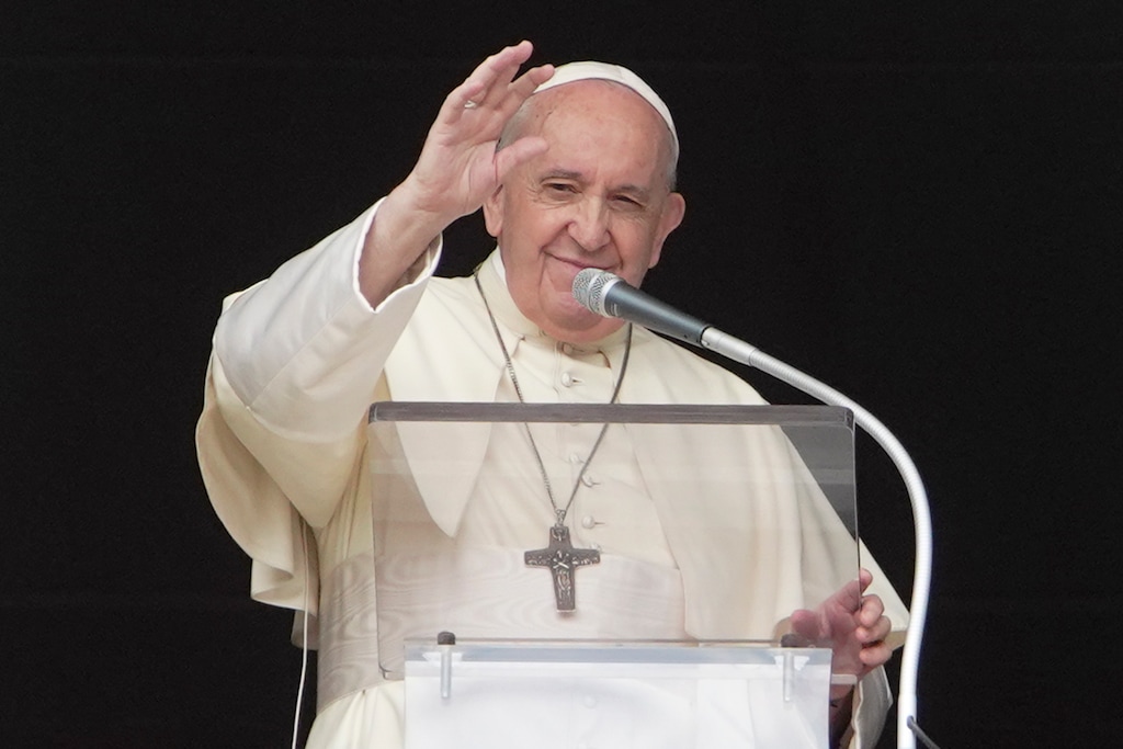 (Andrew Medichini | AP) Pope Francis delivers his blessing as he recites the Angelus noon prayer from the window of his studio overlooking St.Peter's Square, at the Vatican, Sunday, Sept. 20, 2020.