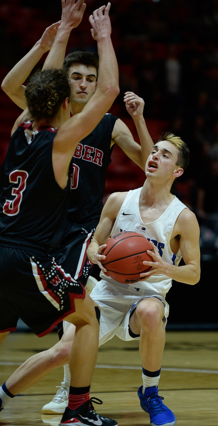 (Francisco Kjolseth  |  The Salt Lake Tribune)  Weber vs Pleasant Grove, 6A State high school basketball tournament at the Huntsman Center in Salt Lake City, Thursday March 1, 2018. Pleasant Grove's Tyler Fairbanks (12) hits the Weber defense. 