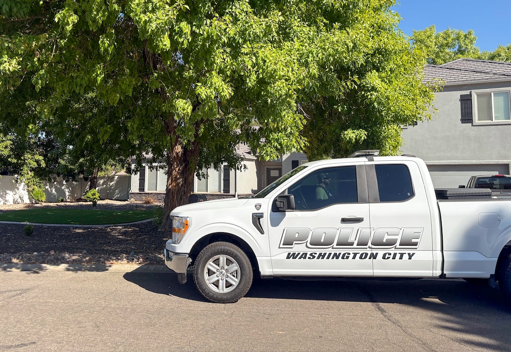 (Brooke Larsen | The Salt Lake Tribune) Police are stationed outside a house where Tyler Robinson reportedly lives in Washington City, Friday, Sept. 12, 2025. Robinson was arrested Friday as a suspect in the shooting death of Charlie Kirk in Orem on Wednesday.