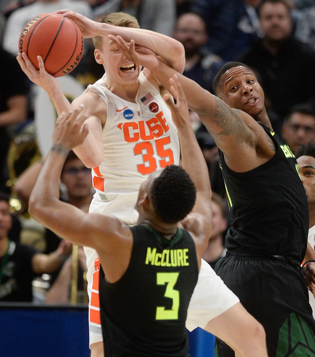 (Francisco Kjolseth  |  The Salt Lake Tribune)  Syracuse Orange guard Buddy Boeheim (35) is mobbed by the Baylor defense as Syracuse faces Baylor in their first round men's NCAA March Madness tournament game at Vivint Smart Home Arena in Salt Lake City on Thursday, March 21, 2019.