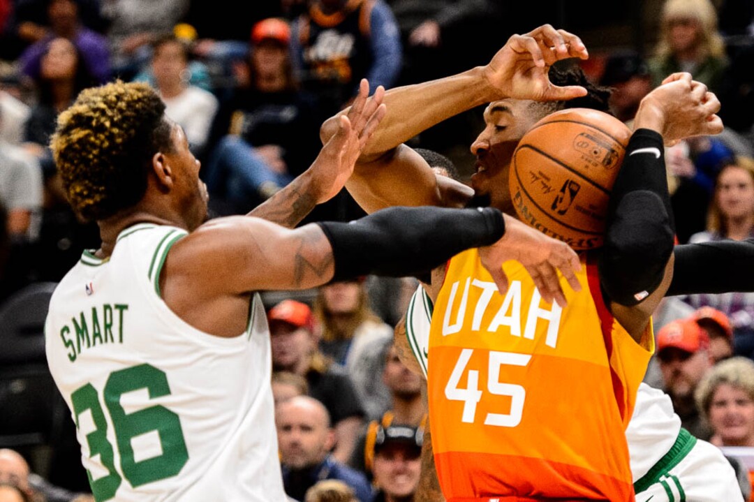 (Trent Nelson | The Salt Lake Tribune)  Utah Jazz guard Donovan Mitchell (45) defended by Boston Celtics guard Marcus Smart (36). Utah Jazz vs. Boston Celtics, NBA basketball in Salt Lake City on Friday Nov. 9, 2018.