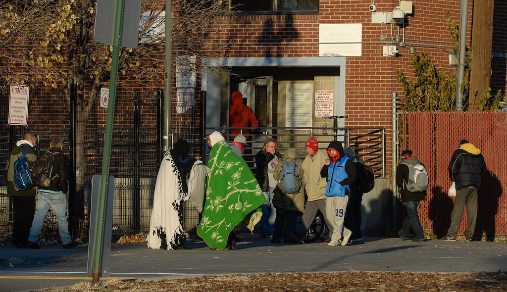 (Francisco Kjolseth  |  Tribune file photo)  People gather outside the men's side entrance to the Road Home in Salt Lake City at the end of the day on Wednesday, Oct. 30, 2019.