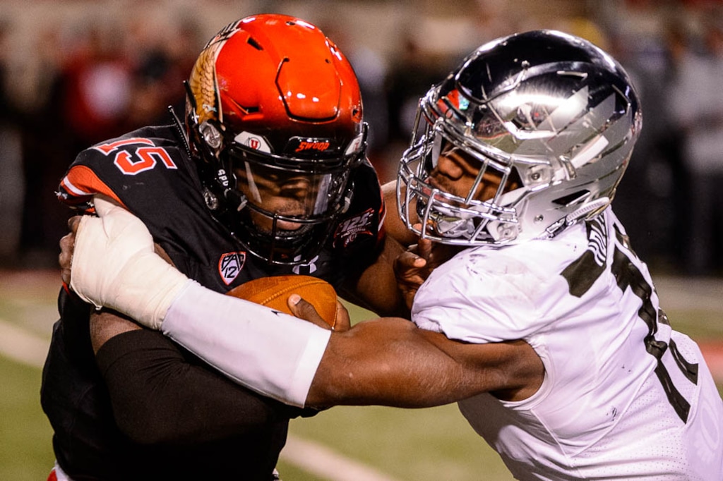 i(Trent Nelson | The Salt Lake Tribune)
Utah Utes quarterback Jason Shelley (15) is sacked by Oregon Ducks linebacker Justin Hollins (11). Utah Utes host the Oregon Ducks, NCAA football at Rice-Eccles Stadium in Salt Lake City on Saturday Nov. 10, 2018. The teams could meet only in the Pac-12 championship game in 2019.