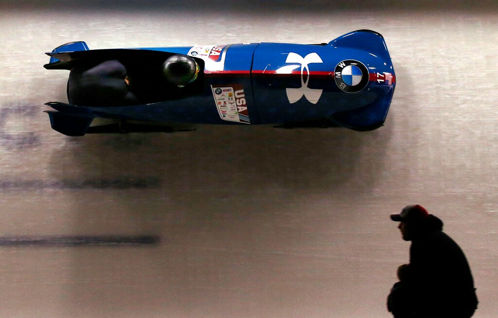 Codie Bascue and Carlo Valdes, of the United States, round a curve at the World Cup bobsled opener in Lake Placid, N.Y.,n Thursday, Nov. 9, 2017. The two placed third in the event. (AP Photo/Peter Morgan)