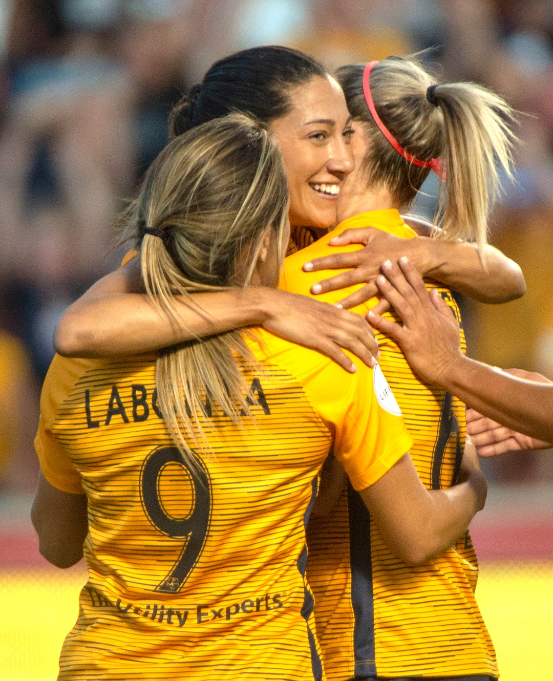 (Rick Egan  |  The Salt Lake Tribune)    Utah forward Christen Press (23) gets hugs from Utah Royals FC midfielder Lo'eau LaBonta (9) and Utah Royals FC defender Becky Sauerbrunn (16), after scoring a goal for the Royals, in Soccer action between Utah Royals FC and Portland Thorns FC, in Sandy, Friday, July 19, 2019.