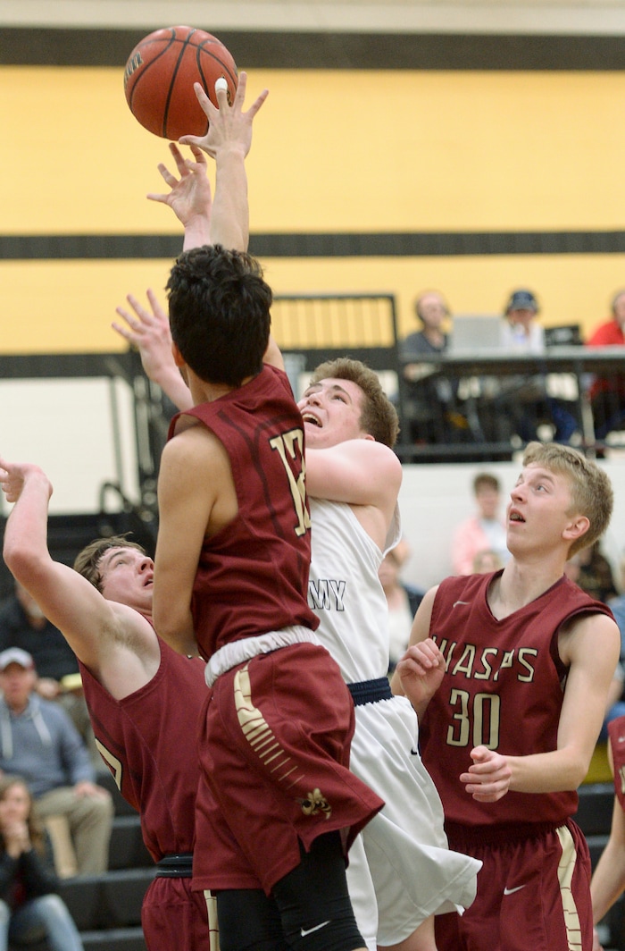 (Leah Hogsten  |  The Salt Lake Tribune) Summit's Edgar Wilson shoots around Juab's defense. Juab High School boys' basketball team defeated Summit Academy 61-58 during their 3A State tournament game in Heber  Saturday, Feb. 16, 2018.