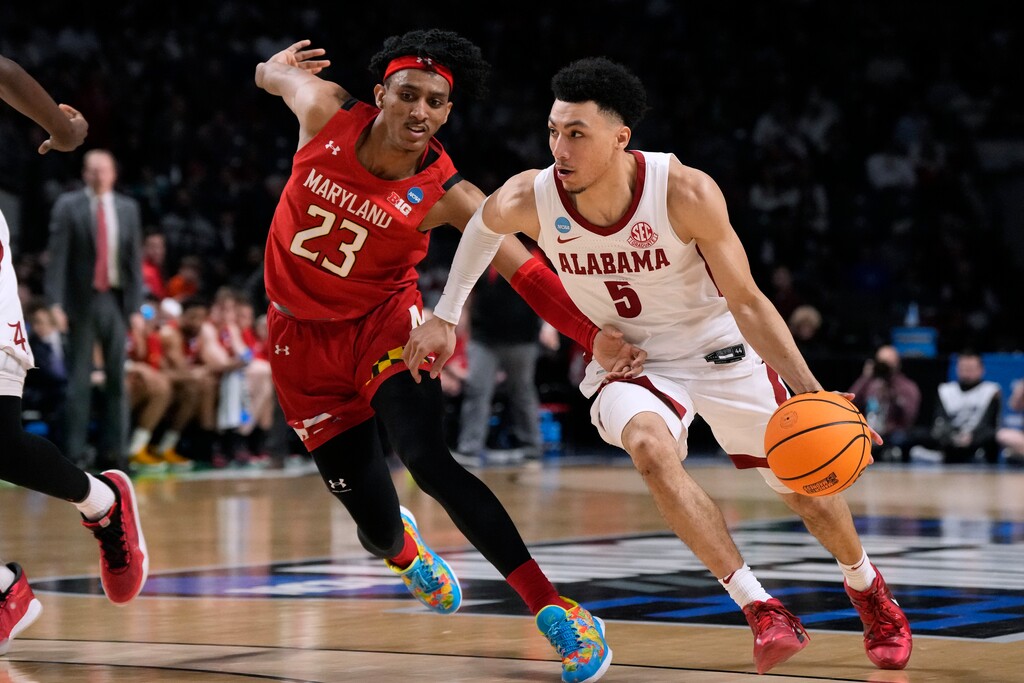 (Rogelio V. Solis | AP) Alabama guard Jahvon Quinerly (5) drives past Maryland guard Ian Martinez (23) during the second half of a second-round college basketball game in the men's NCAA Tournament in Birmingham, Ala., Saturday, March 18, 2023.