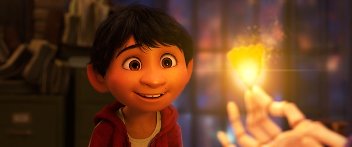 This image released by Disney-Pixar shows characters Miguel, voiced by Anthony Gonzalez in a scene from the animated film, "Coco." (Disney-Pixar via AP)
