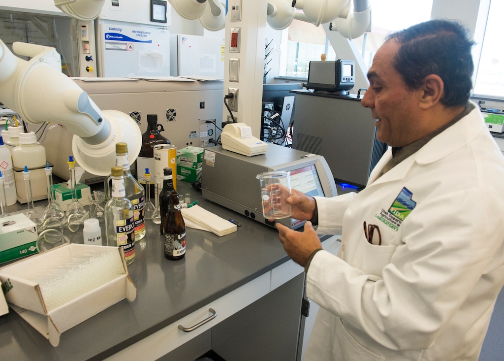 (Rick Egan | The Salt Lake Tribune) Mohammad Sharaf, a lab manager with the Utah Department of Agriculture and Food, demonstrates how to test beer to make sure that it does not exceed the state limit of 4 percent alcohol by volume, on Thursday, Nov. 8, 2018.