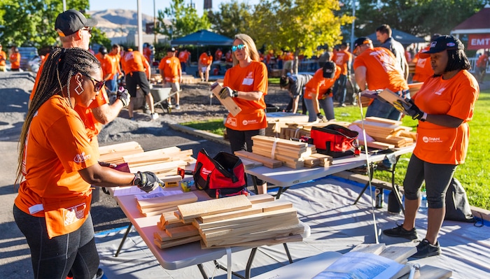 (Rick Egan | The Salt Lake Tribune) More than 600 volunteers, led by Home Depot employees, help spruce up the Sunrise Metro and Freedom Landing apartments in Salt Lake City on Wednesday, Sept. 21, 2022.