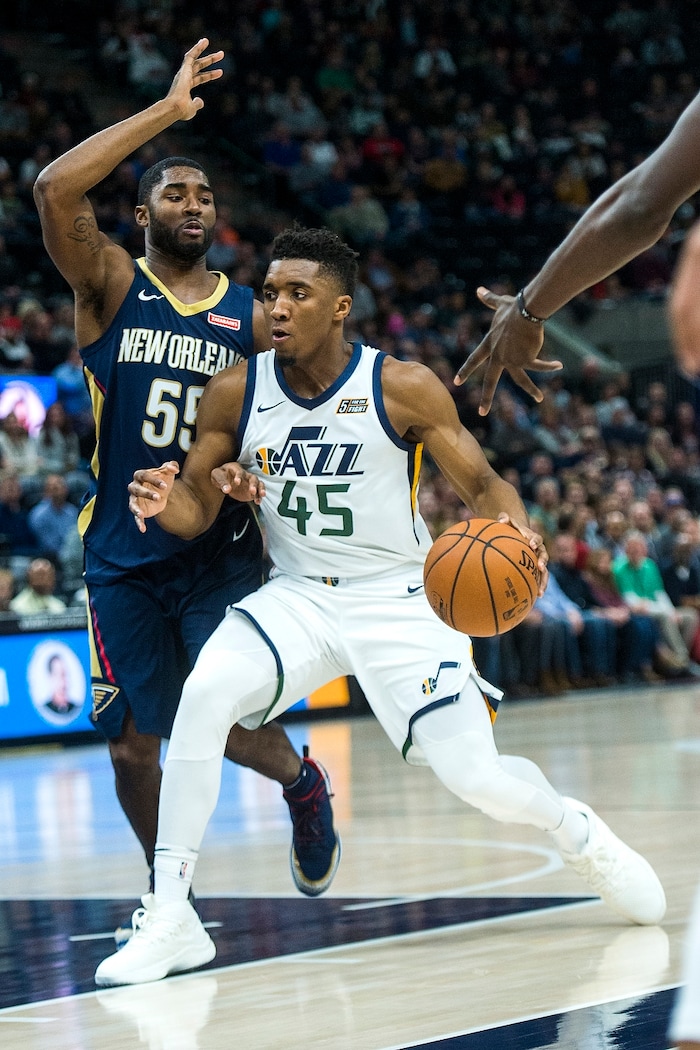 (Chris Detrick  |  The Salt Lake Tribune)  New Orleans Pelicans guard E'Twaun Moore (55) covers Utah Jazz guard Donovan Mitchell (45) during the game at Vivint Smart Home Arena Friday, December 1, 2017.  