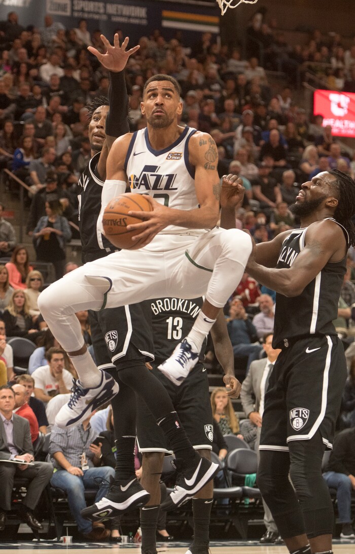 (Rick Egan  |  The Salt Lake Tribune) Utah  forward Thabo Sefolosha (22) goes under neath the basket as he attempts a shot for the Jazz, in NBA action, Utah Jazz vs. Brooklyn Nets, in Salt Lake City, Saturday, November 11, 2017.