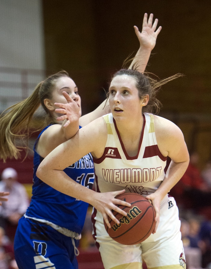 (Rick Egan  |  The Salt Lake Tribune)    Mercedes Staples (12) Viewmont, makes a move to the basket, as Maggie McCord (15) defends for Bingham, in prep basketball action, Bingham vs. Viewmont, in Bountiful, Wednesday, January 3, 2018.