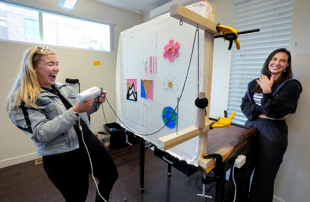 (Francisco Kjolseth | The Salt Lake Tribune) Maddie Hassinger, left, has fun rug tufting for the first time with the help of Linda Matson at Rug Lounge in the 9th and 9th neighborhood on Wednesday, April 15, 2026, during the studio's soft-open phase.