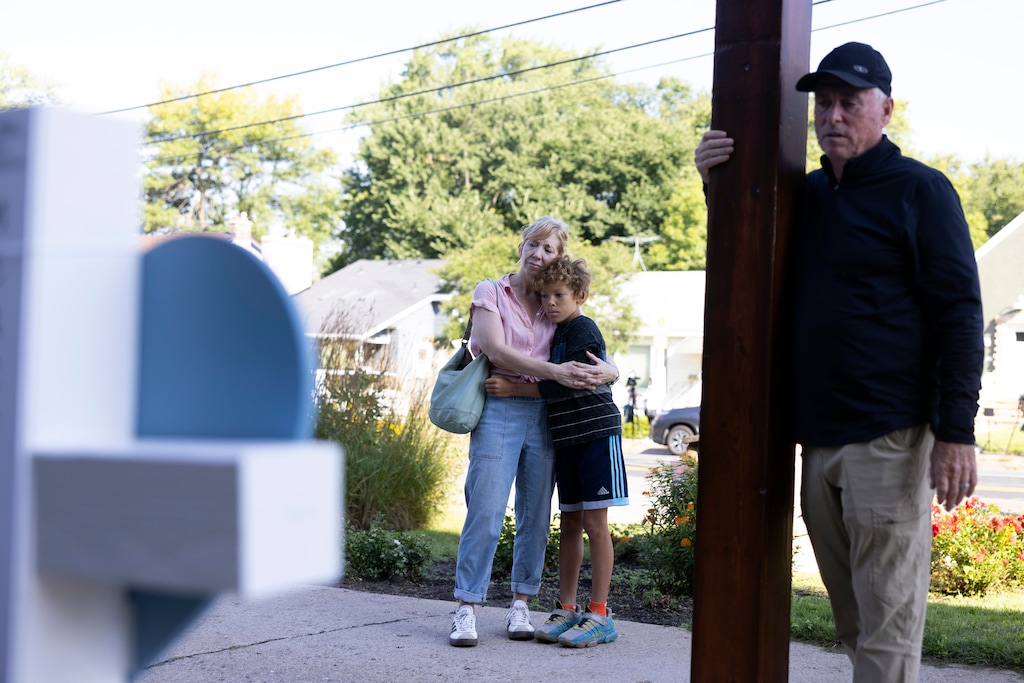 (Jenn Ackerman | The New York Times) Mourners gather outside Annunciation Catholic Church in Minneapolis.