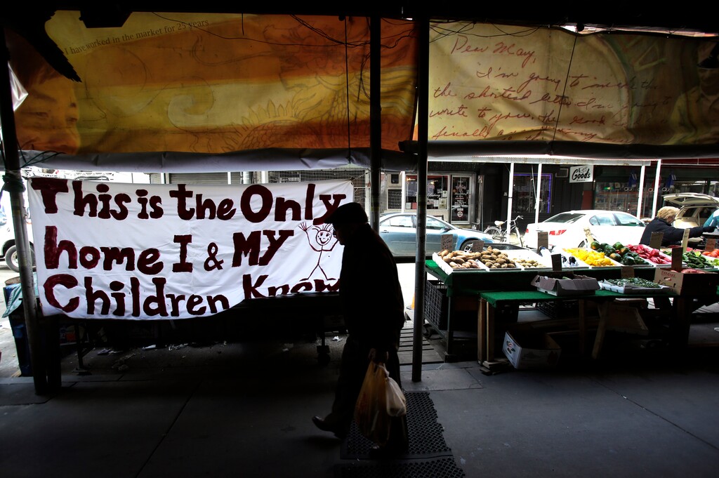 A shopper walks past a sign hanging outside the closed Marco's Fish Market, Thursday, Feb. 16, 2017, in south Philadelphia's Italian Market. In an action called "A Day Without Immigrants", immigrants across the country are expected to stay home from school and work on Thursday to show how critical they are to the U.S. economy and way of life. (AP Photo/Jacqueline Larma)