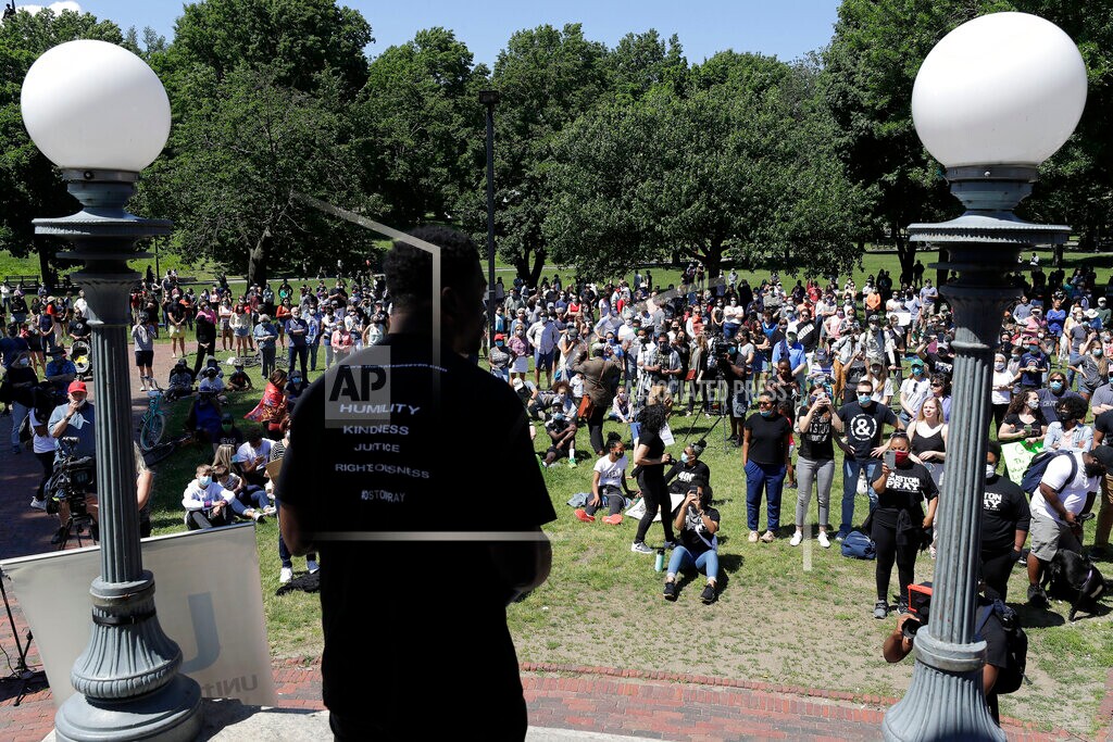 (Steven Senne | AP) In this Sunday, June 14, 2020, file photo, Benjamin Watson, a former New England Patriots football player, front, addresses an audience in Boston during an event called "Boston Pray: Seeking Unity and Justice," held to call for an end to racial injustice, triggered by the death of George Floyd, an African American man who died on May 25 as a Minneapolis police officer pressed his knee into his neck. Watson, along with a coalition of Christian groups, including the Church of God in Christ and the National Association of Evangelicals, is launching a new criminal justice reform push that seeks to rally believers behind policing changes grounded in biblical principles.