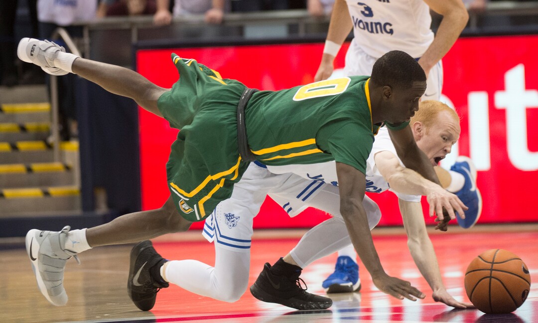 (Rick Egan  |  The Salt Lake Tribune)  Brigham Young Cougars guard TJ Haws (30) gets for the ball along with San Francisco Dons guard Souley Boum (0), in basketball action at the Marriott Center, Saturday, February 10, 2018.