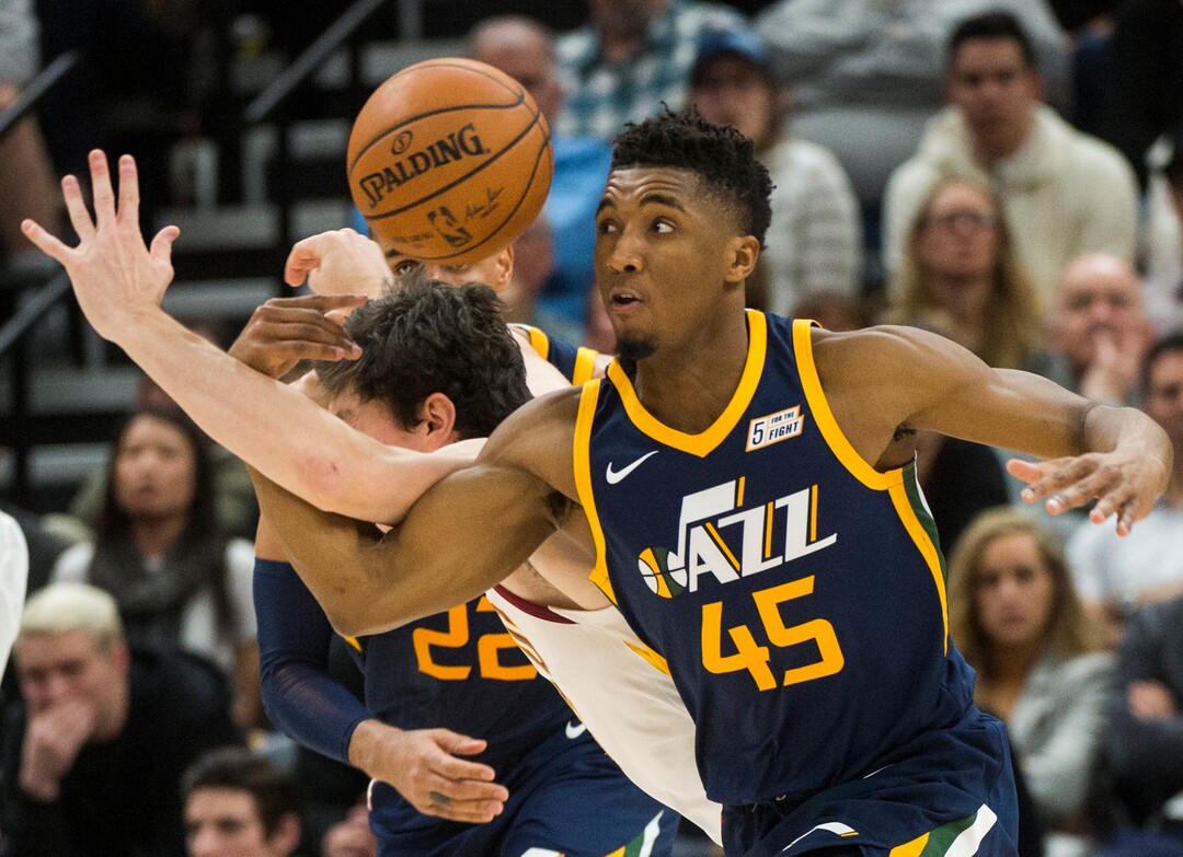 (Rick Egan  |  The Salt Lake Tribune)   Utah Jazz guard Donovan Mitchell (45) steals the ball from Cleveland Cavaliers forward Cedi Osman (16), in NBA action Utah Jazz vs Cleveland Cavaliers, in Salt Lake City,  Saturday, December 30, 2017.